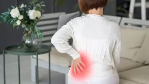 A Woman Having A Back Pain