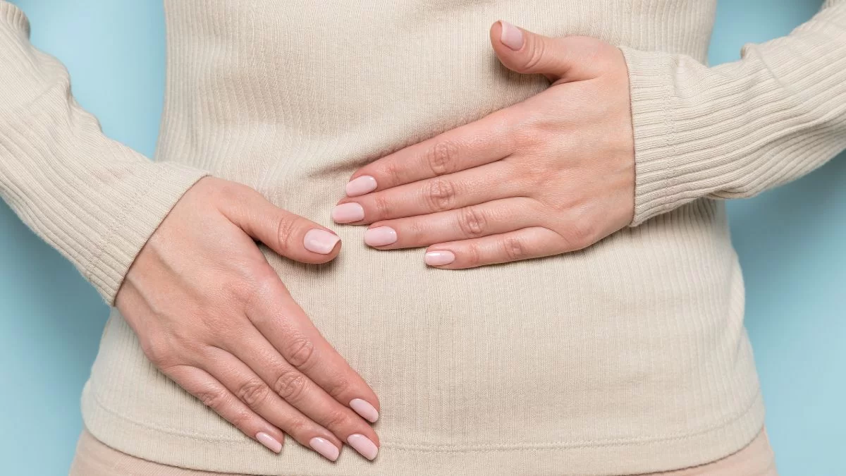 Close Up Of A Women Holding A Stomach