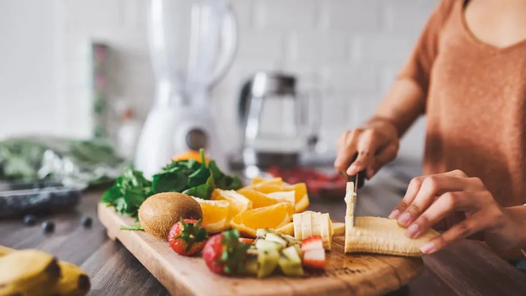  Woman Preparing Healthy Meal In Kitchen 
